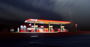 A brightly lit gas station in Norrtälje, Sweden, captured at night with a long exposure.