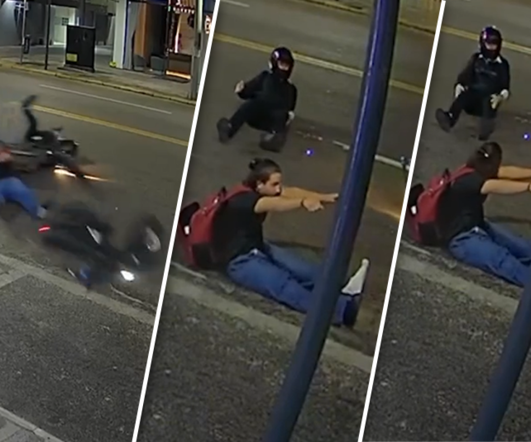 Cômico, mas quase trágico: sentado no asfalto, segundos após a queda, condutor parece dirigir uma moto invisível.